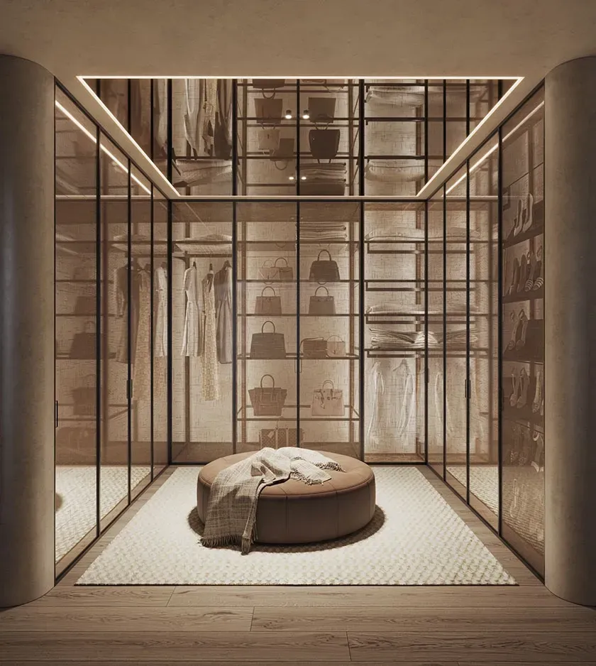 Open-plan living space with modern lighting, sleek furnishings and a soft, neutral palette.