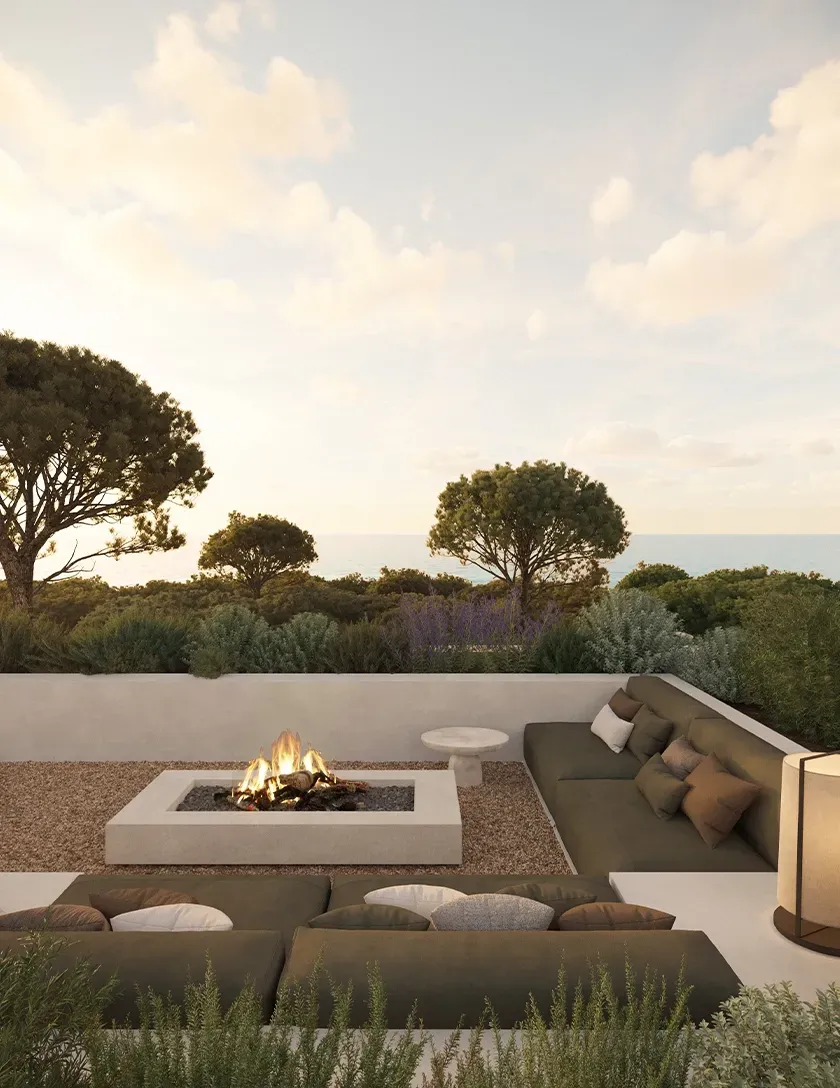 Outdoor lounge with sunken fire pit and built-in seating, offering a warm, intimate luxury experience.