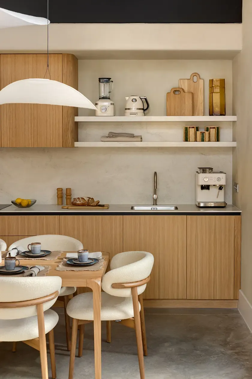 Minimalist kitchen with natural wood finishes and open shelving in modern loft