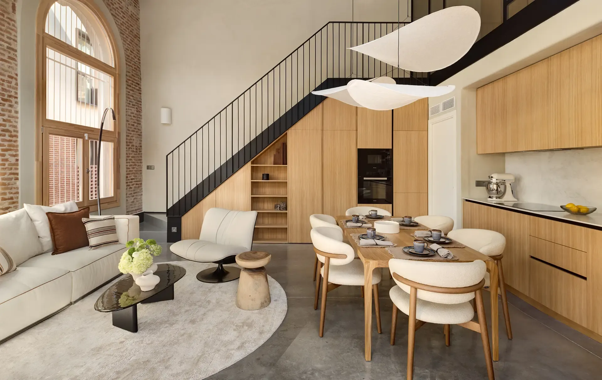 Open-plan luxury loft with double-height ceilings and contemporary interior design