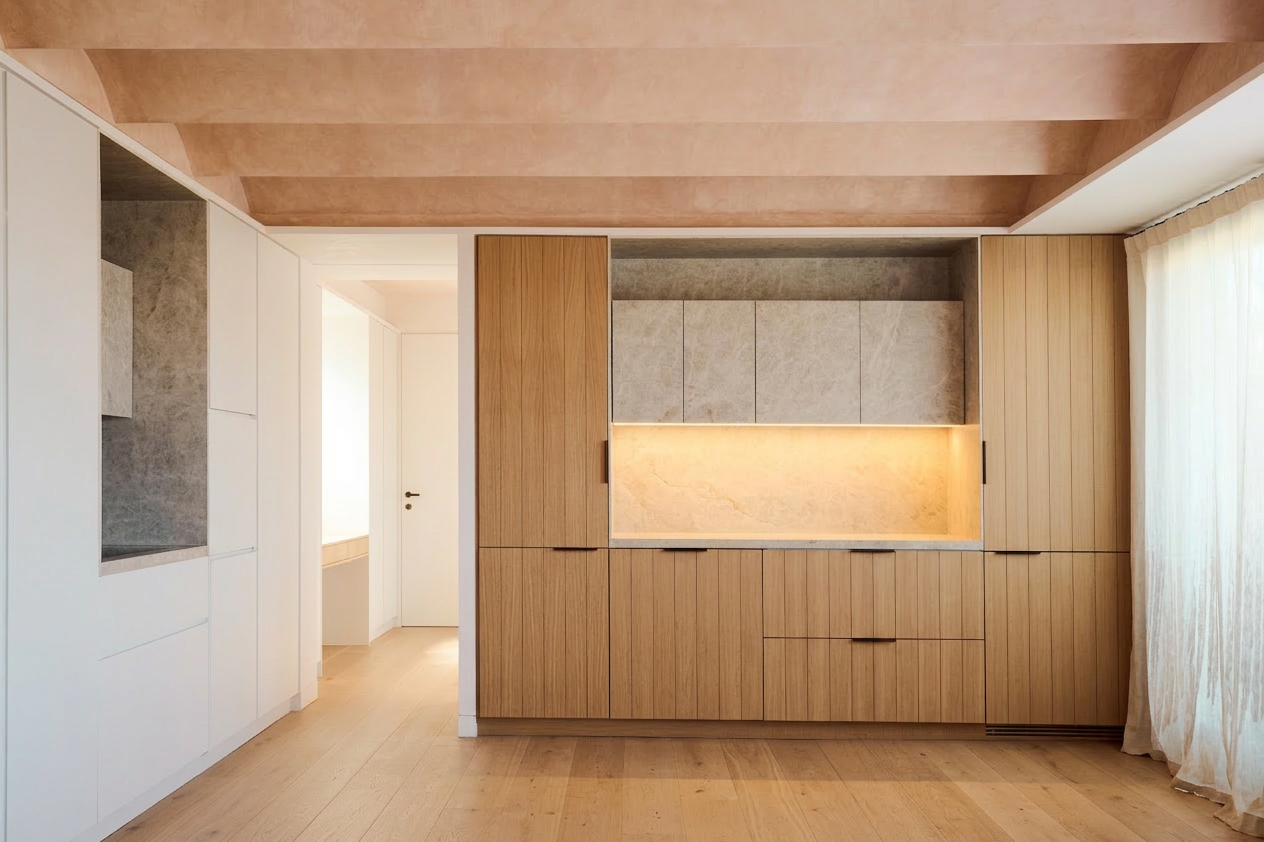 Minimalist kitchen with wood cabinetry, integrated lighting and natural materials in contemporary design