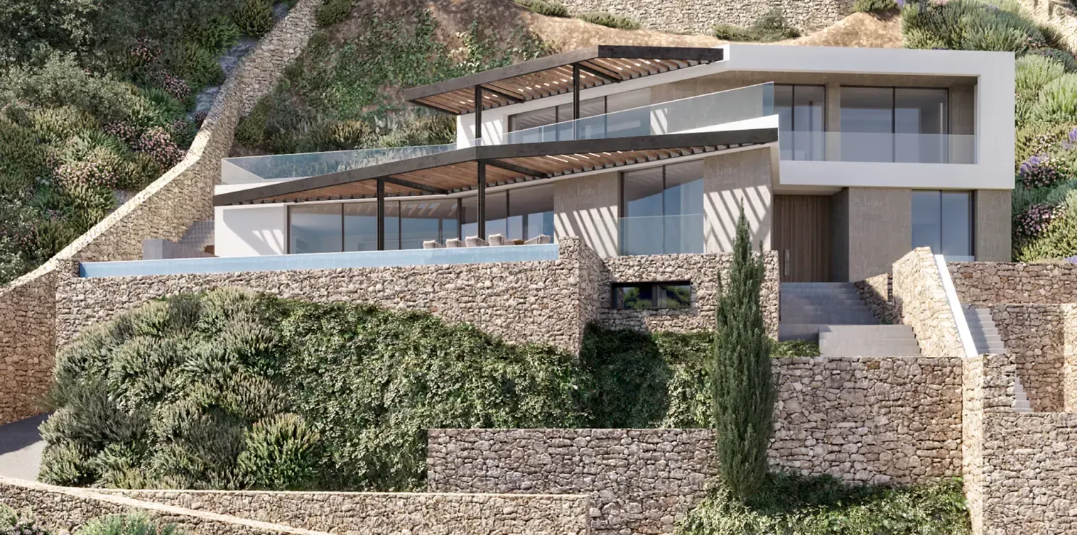 Contemporary hillside villa by Luv Studio in Menorca, featuring layered stone terraces and panoramic views.