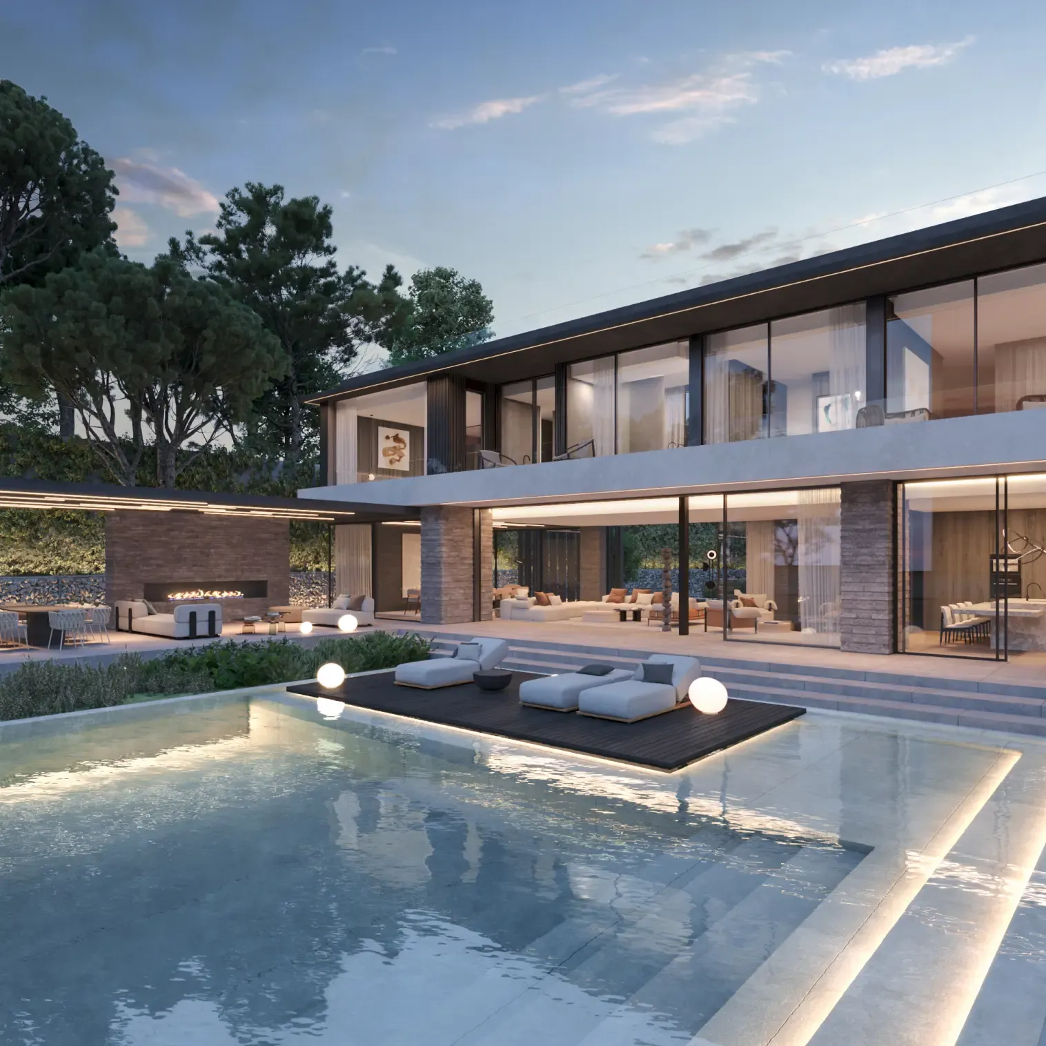 Contemporary villa with illuminated poolside terrace and ambient outdoor lighting at night.