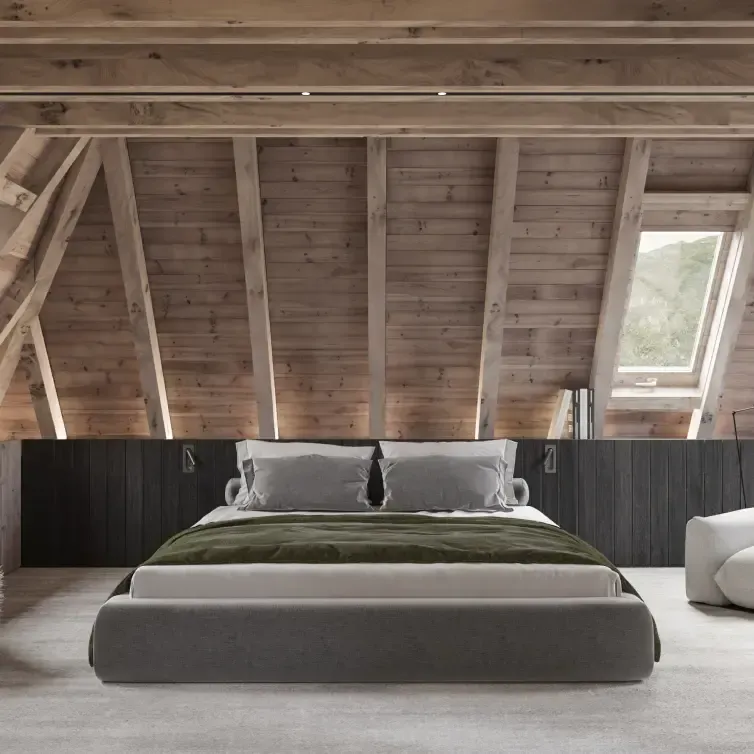 Minimalist attic bedroom with wood beams and plush seating, expressing Luv studio’s signature luxury style.