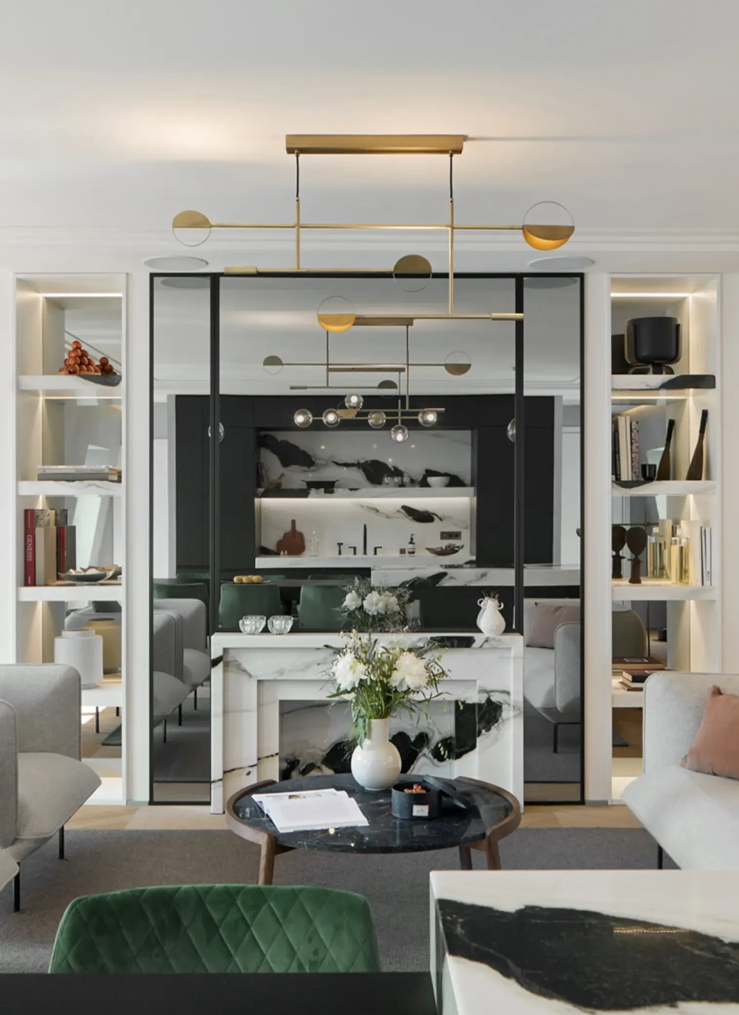 Elegant living area of Champs Elysées Apartment with modern sofas, marble accents, open shelving, and refined contemporary interior design.