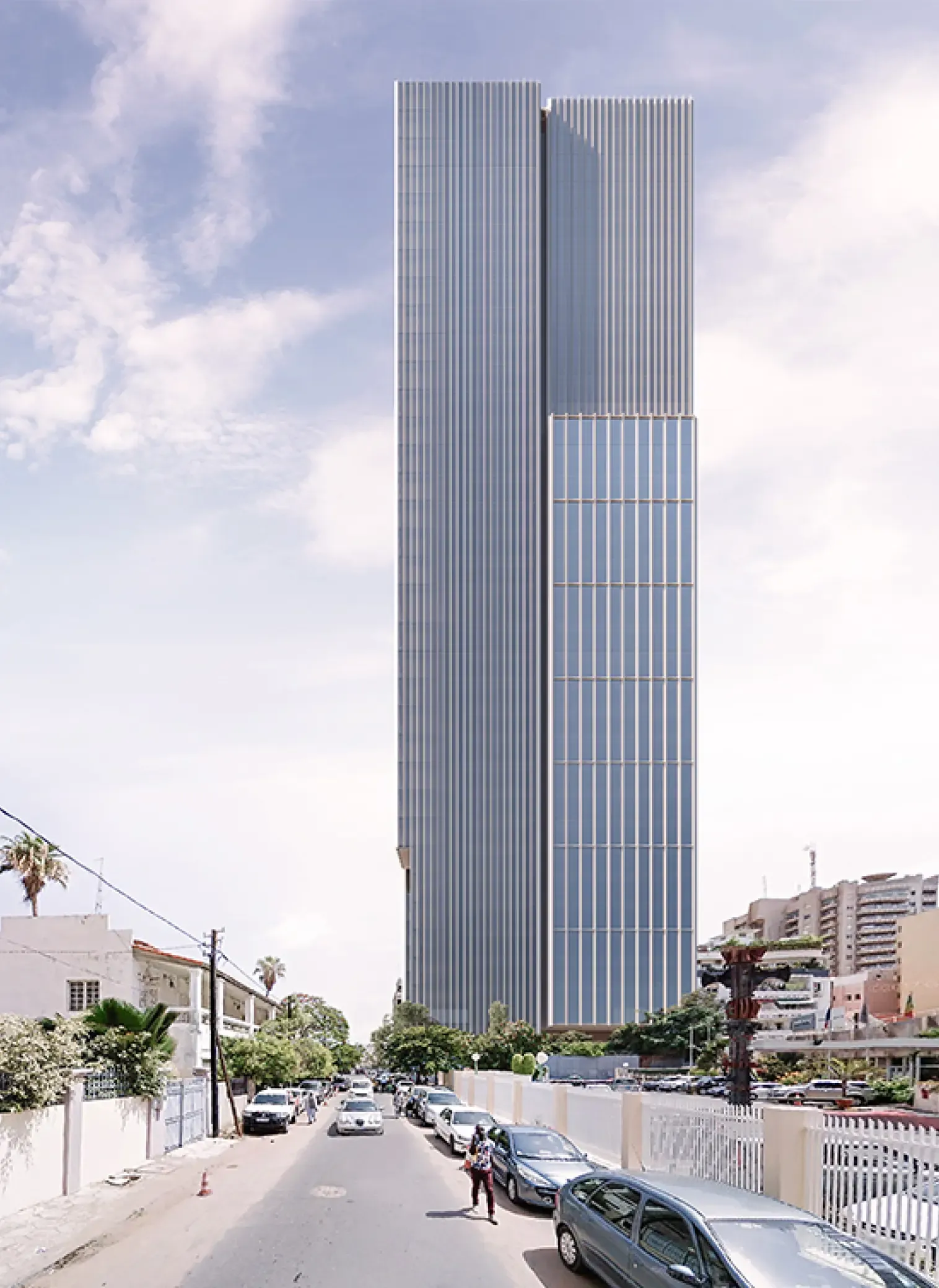 Daytime view of the Energy Tower rising above the city, with vertical lines and glazed façades dominating the skyline.