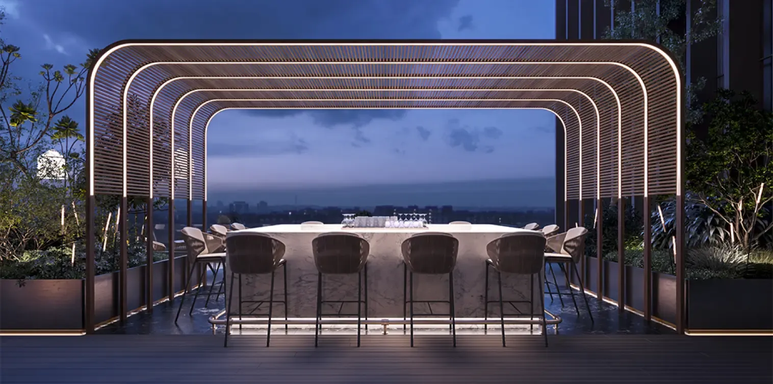 Nighttime rooftop bar with curved wooden canopy and marble counter, overlooking the city skyline under a moody sky.