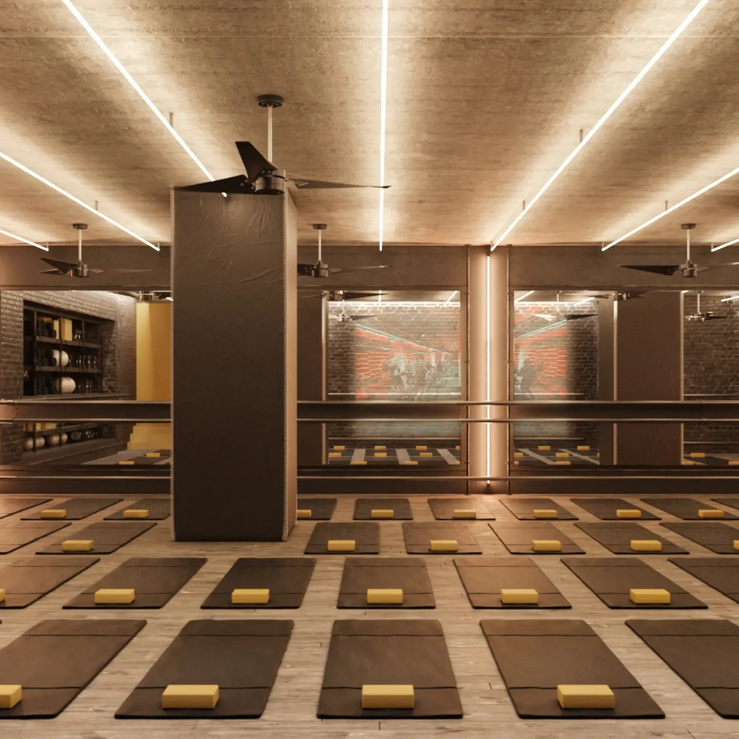 Warmly lit yoga or pilates studio with mats, props, and mirrored walls for group fitness sessions.