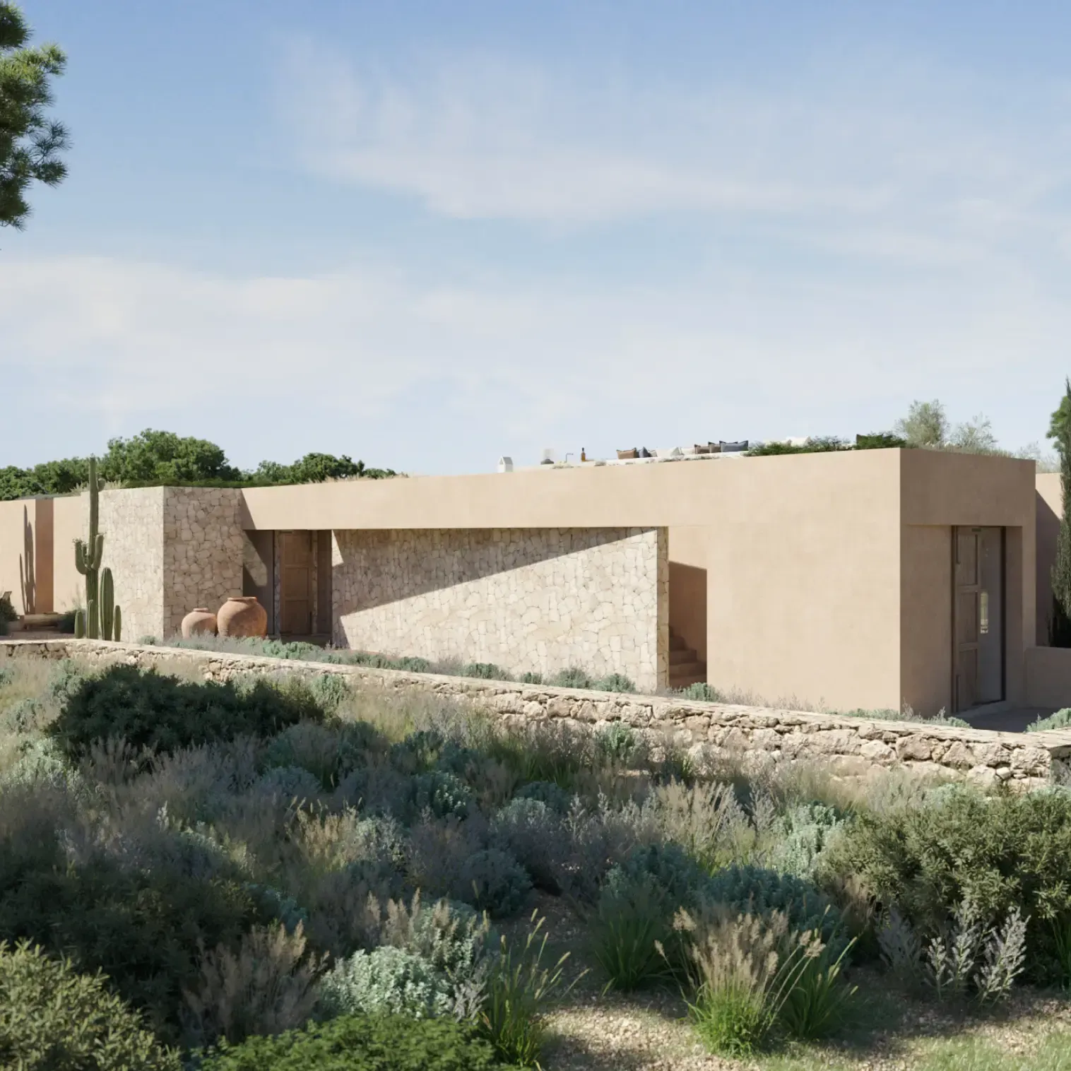 Aerial view of the villa blending into the Mediterranean landscape with natural stone and earth-toned architecture.