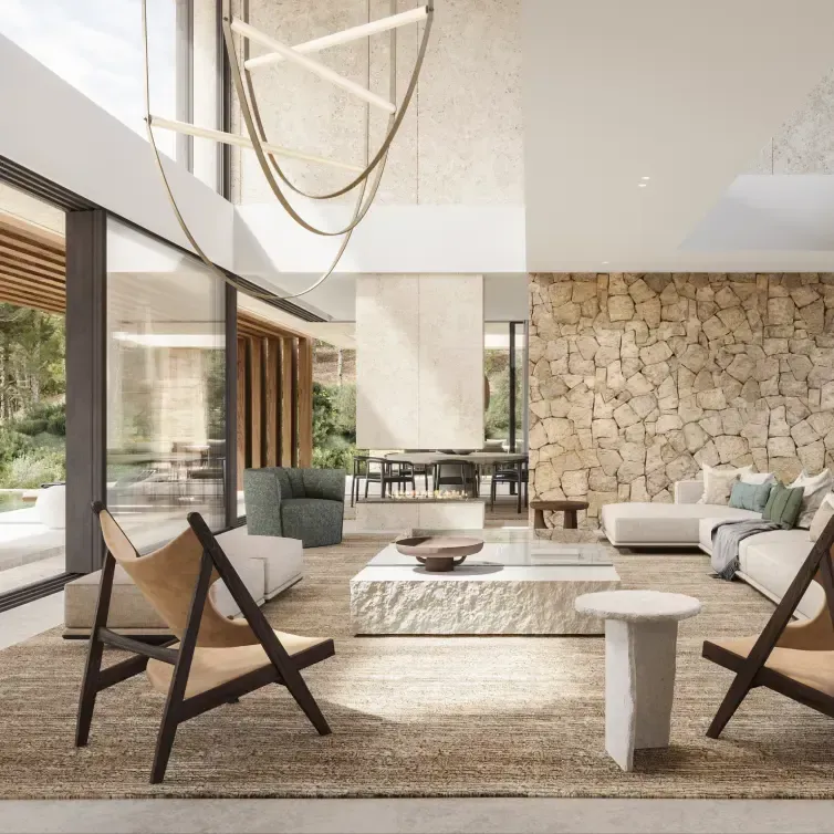 Interior stone wall with designer furniture in a bright, open-plan living area.