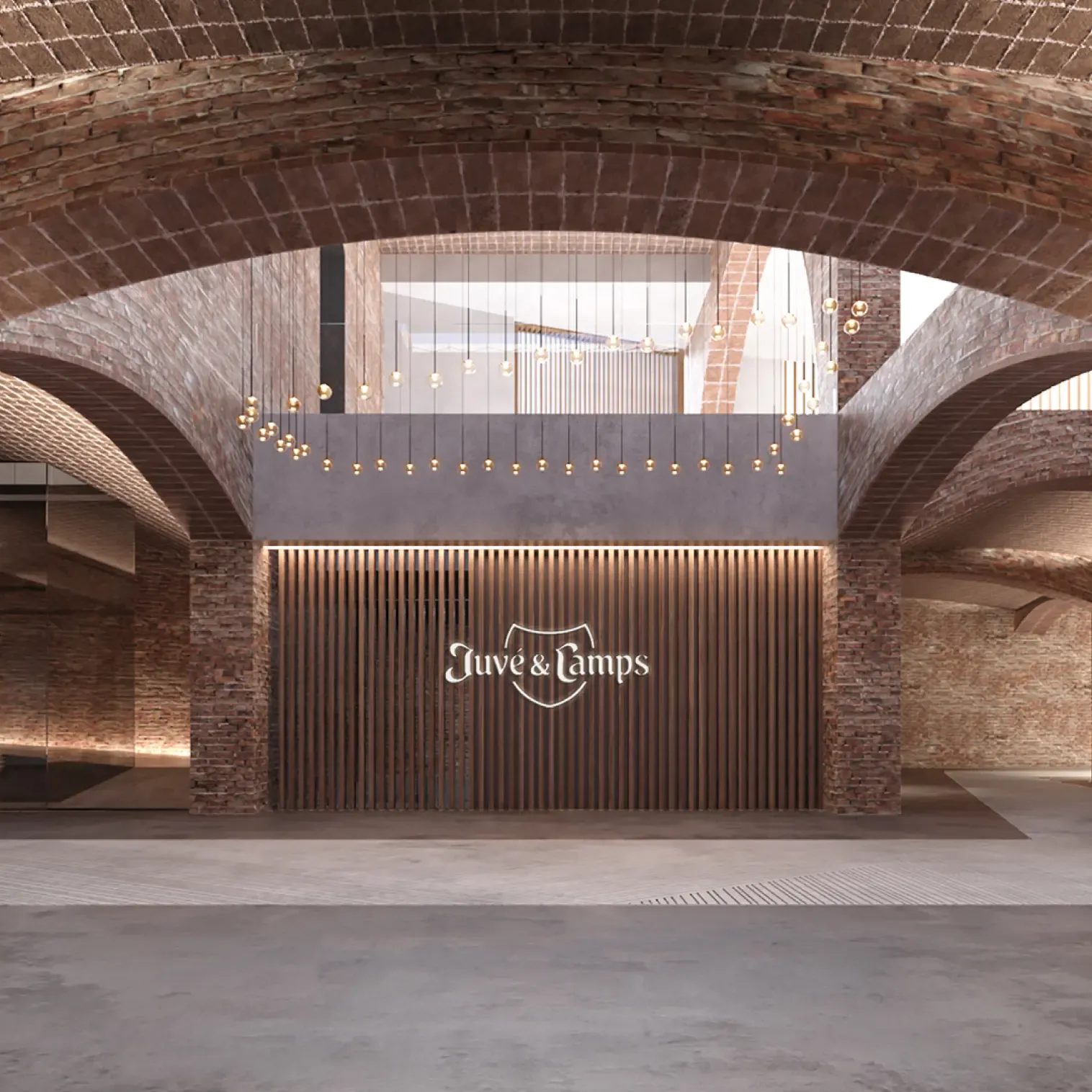Entrance lobby of Juvé & Camps Winery showcasing vaulted brick architecture and warm ambient lighting.