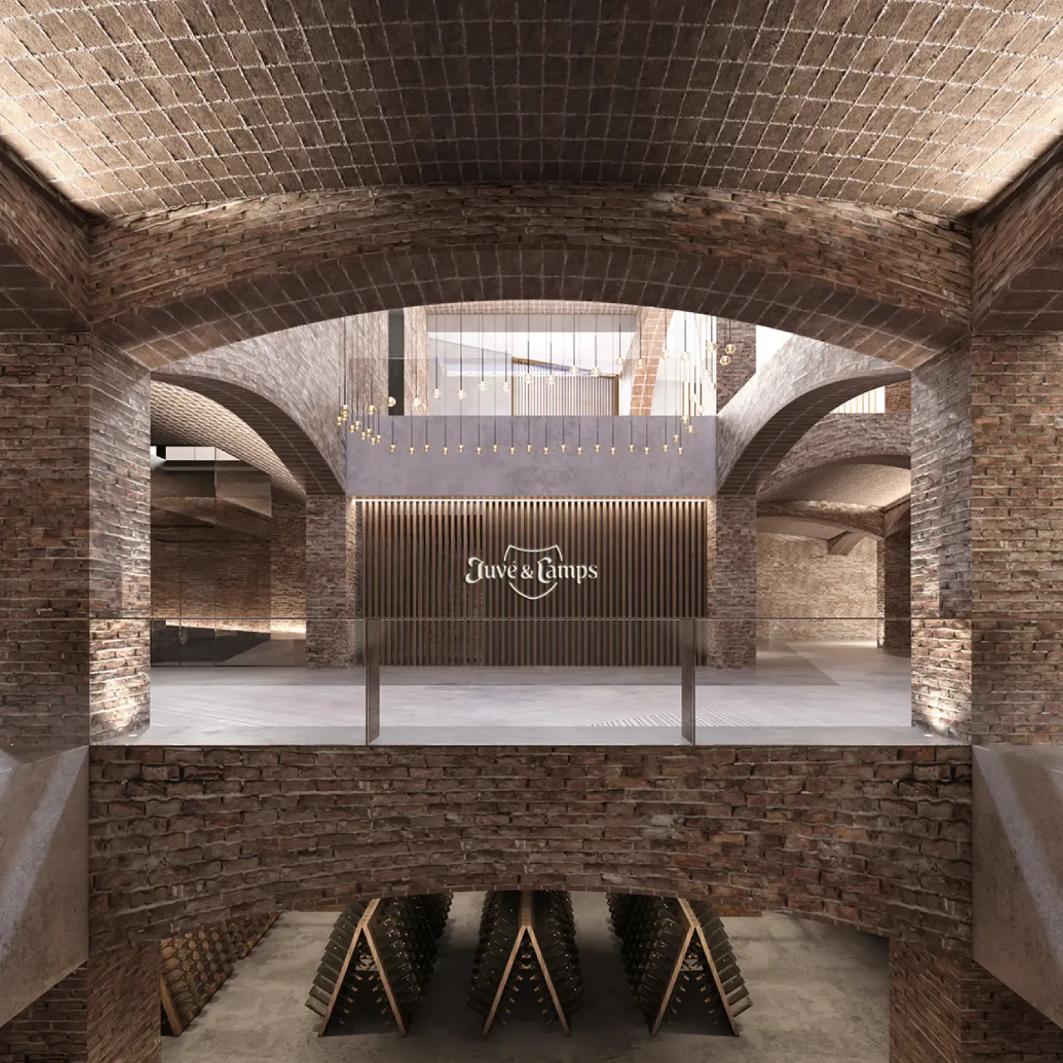 Lobby space with suspended lighting and wood slatted feature wall with Juvé & Camps logo.