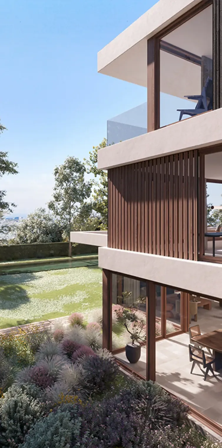 View from garden with large glass windows and integrated outdoor terrace