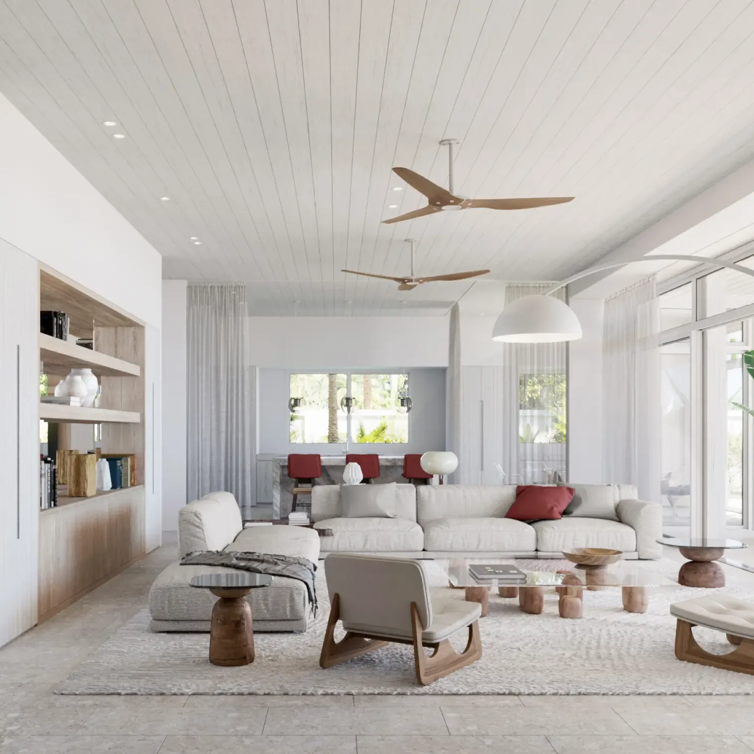 Elegant living area with modern furniture, soft tones, and access to outdoor lounge by the water.