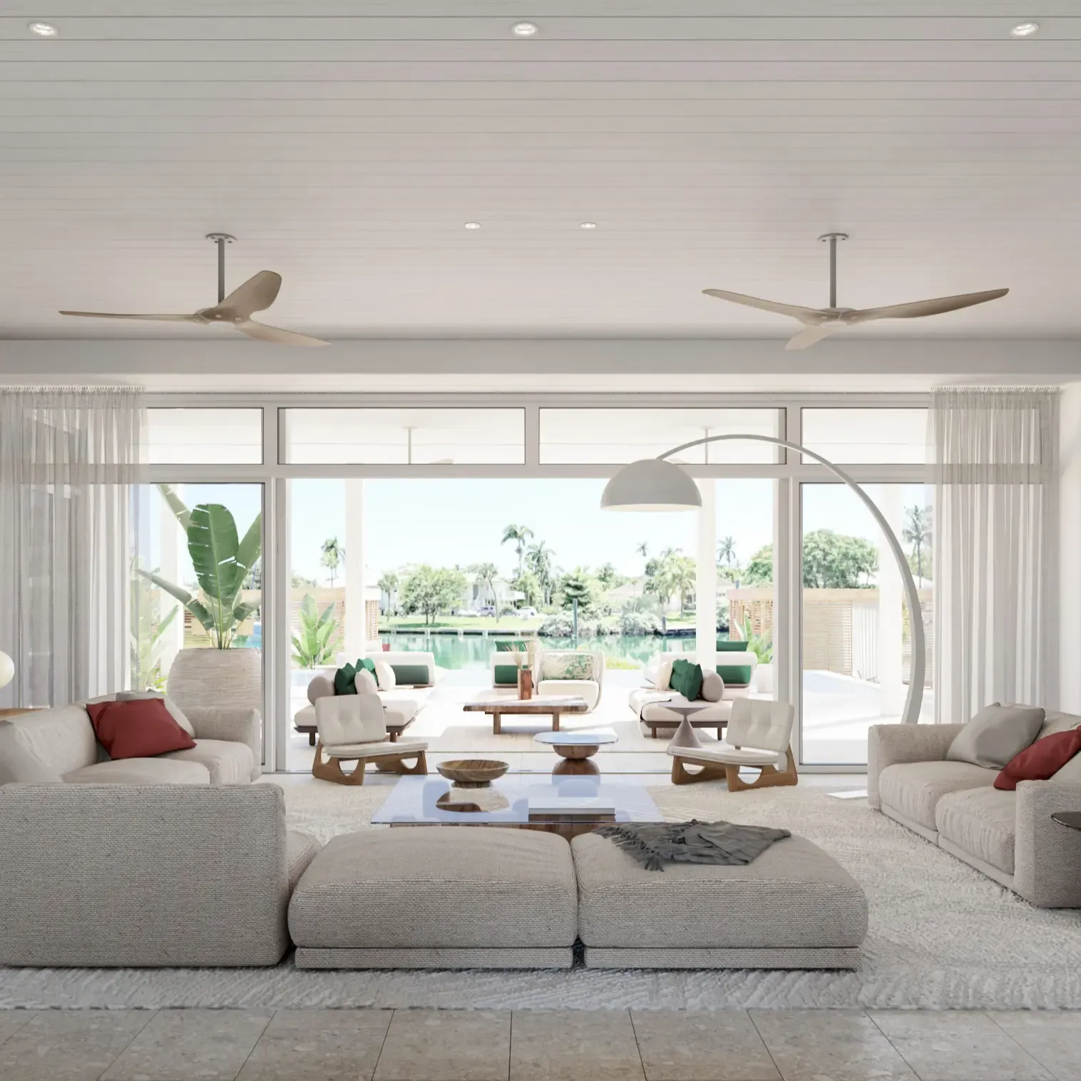 Spacious open-plan living room with neutral decor, panoramic windows, and views of the waterfront.