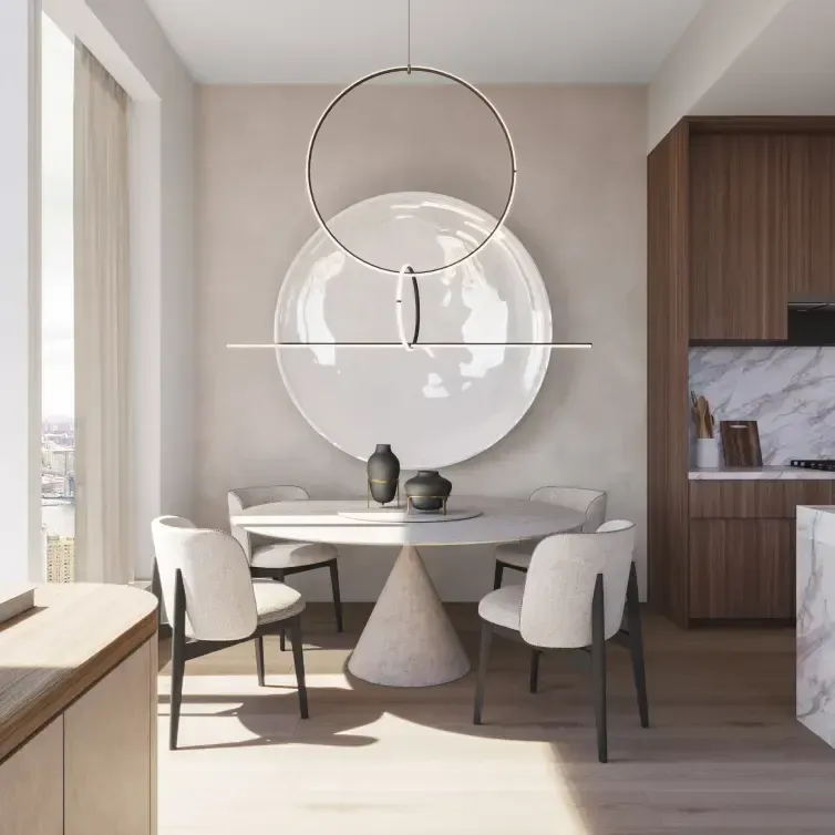 Minimalist dining nook with sculptural lighting and soft tones, designed by Luv studio in a high-rise luxury residence.