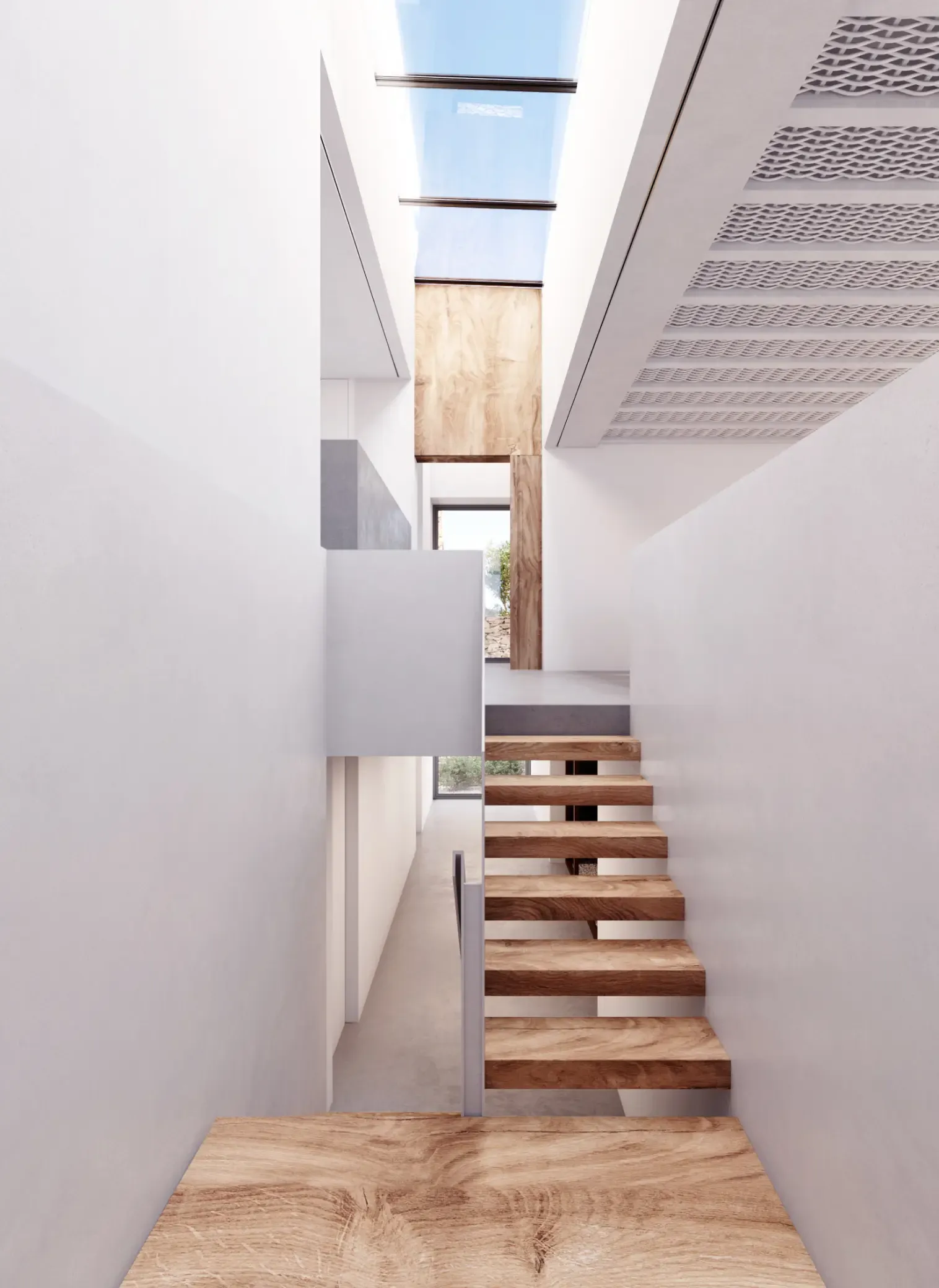 Contemporary floating wooden staircase under a skylight in a minimalist Menorcan villa.