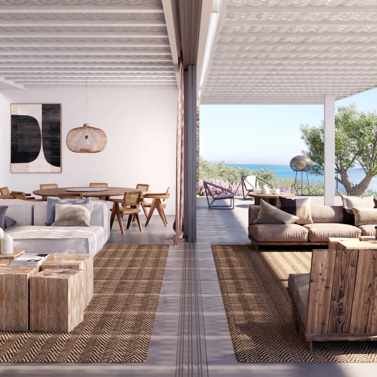 Open-plan living and dining area in a modern coastal villa, featuring natural textures and views of the sea.