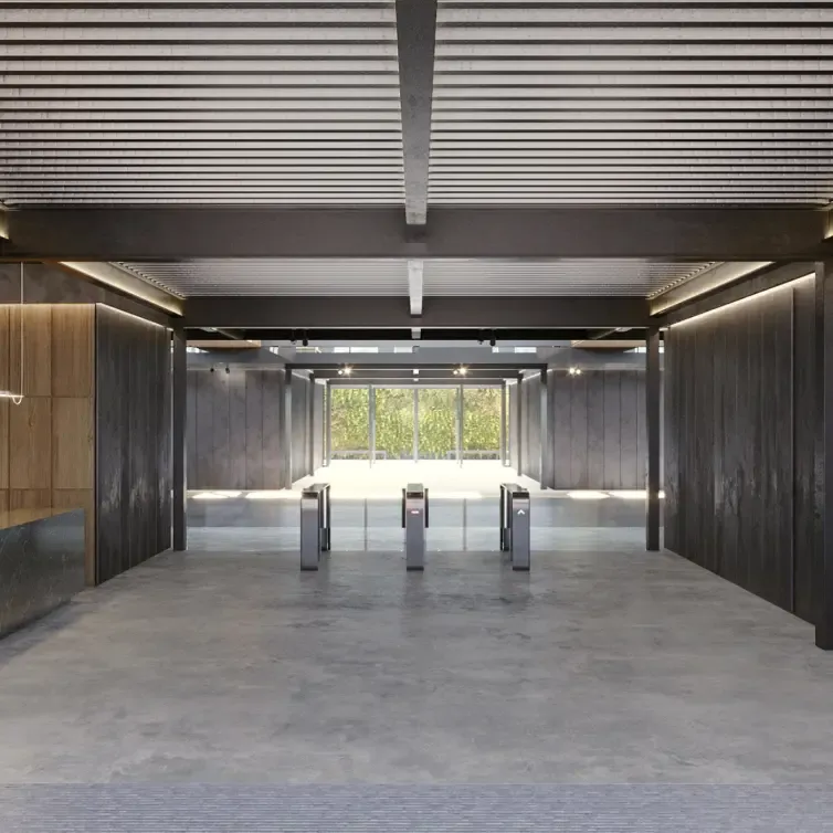Sleek office lobby with marble reception and turnstile access at Titan Building by LUV Studio.