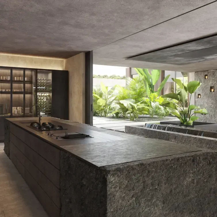 Modern open kitchen with stone island, dark cabinetry, and lush garden view.