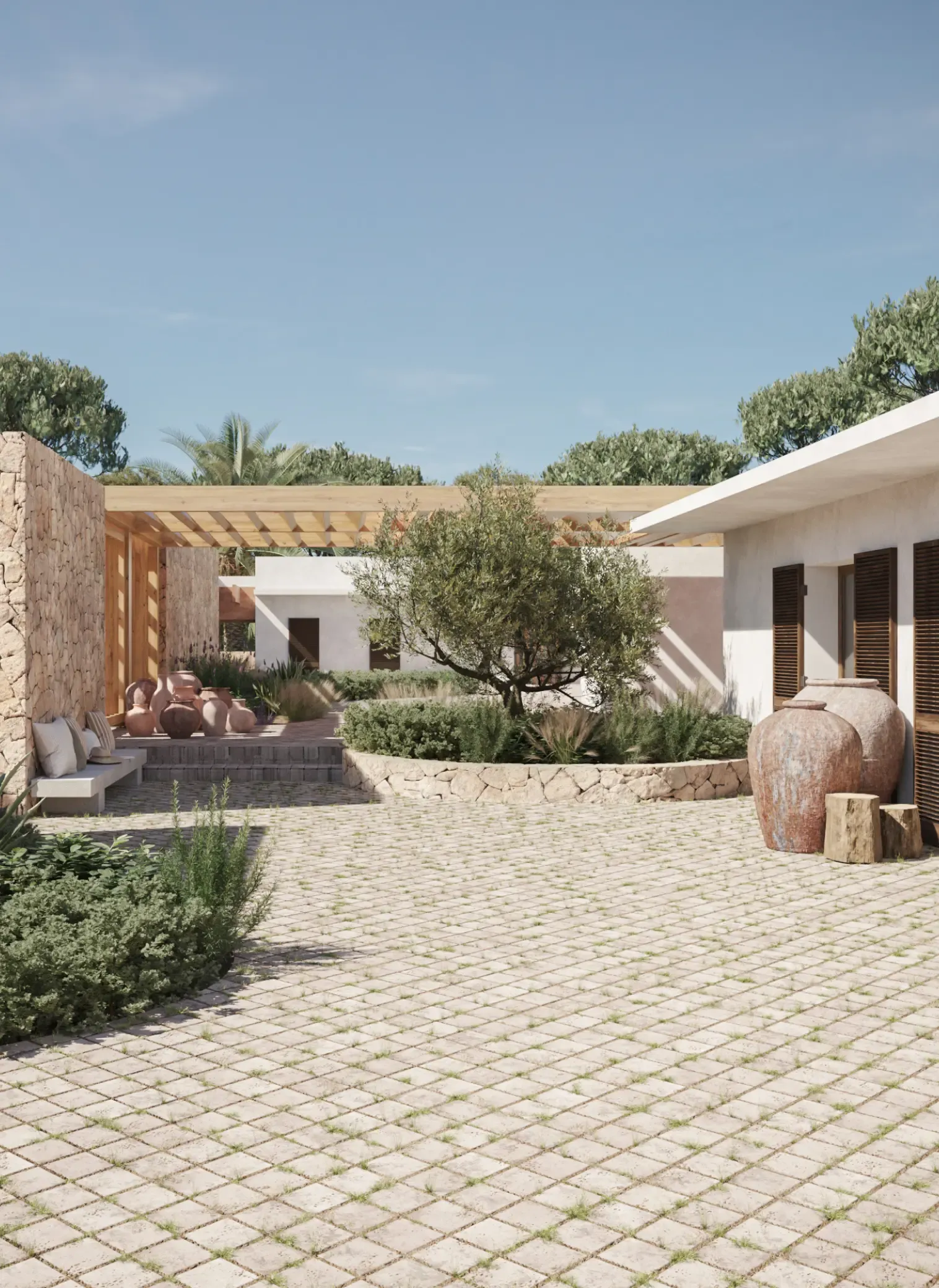 Stone-paved courtyard with Mediterranean vegetation and natural stone walls.