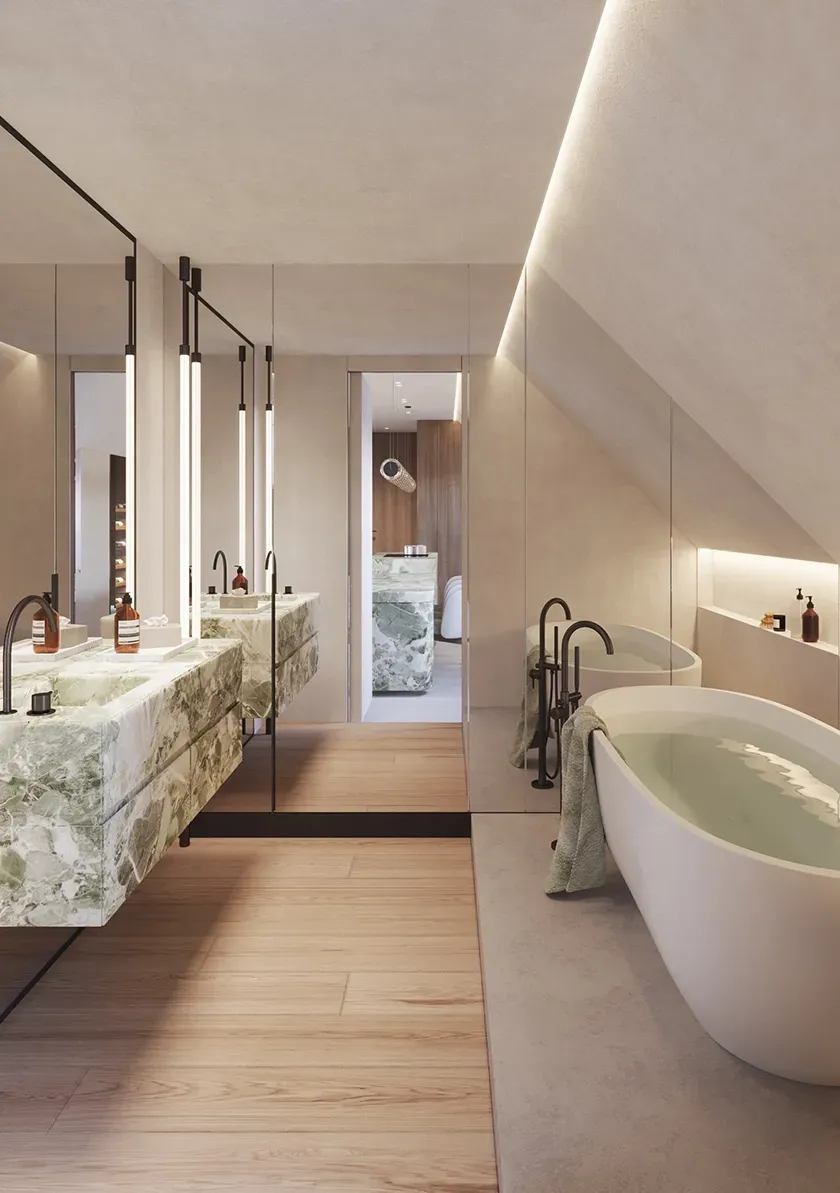 Luxurious attic bathroom featuring a sculptural freestanding bathtub, mirrored walls, and dual green onyx sinks.