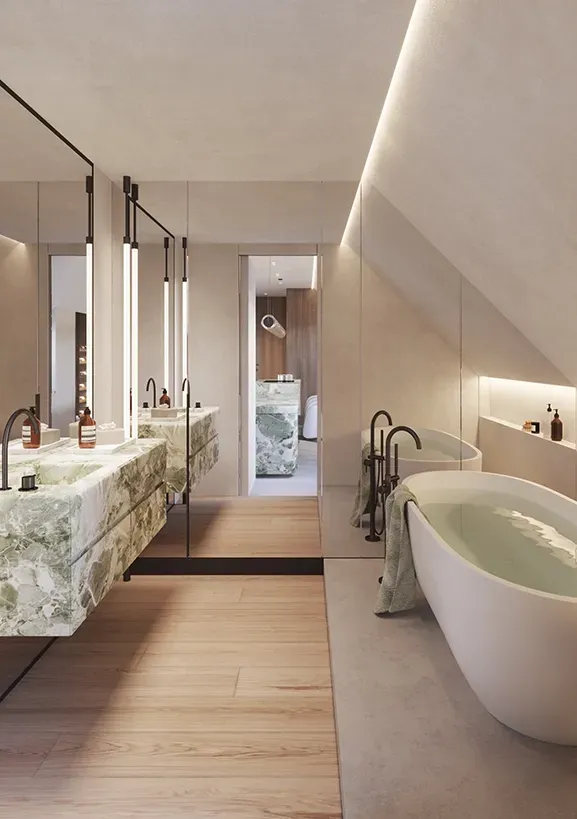 Luxurious attic bathroom featuring a sculptural freestanding bathtub, mirrored walls, and dual green onyx sinks.