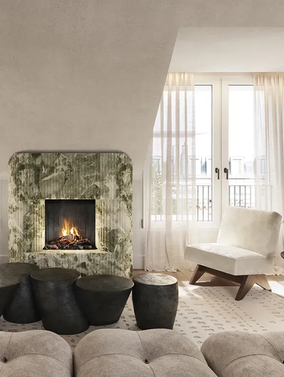Modern lounge with a striking green onyx fireplace, soft neutral tones, and floor-to-ceiling windows.