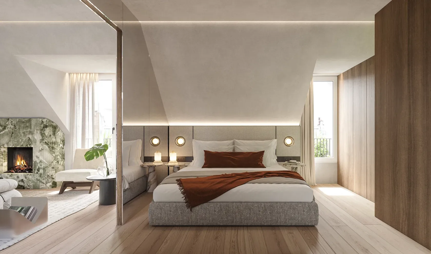 Refined bedroom suite with sloped ceilings, warm wood accents, and a cozy fireplace framed in green marble.