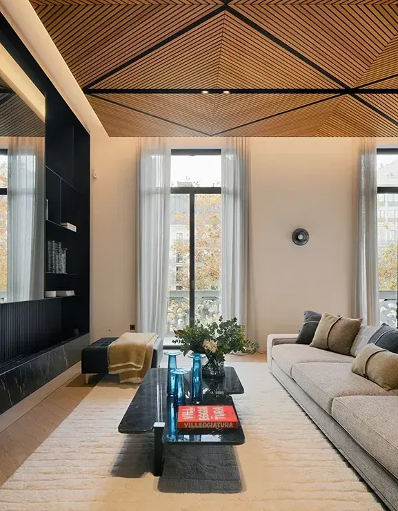 Elegant living area with panoramic windows and high-end architectural details.