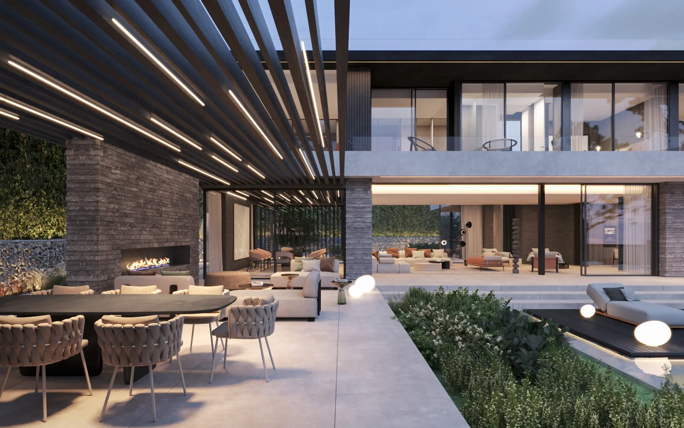 Covered outdoor lounge area with natural textures and designer furniture, overlooking the garden.