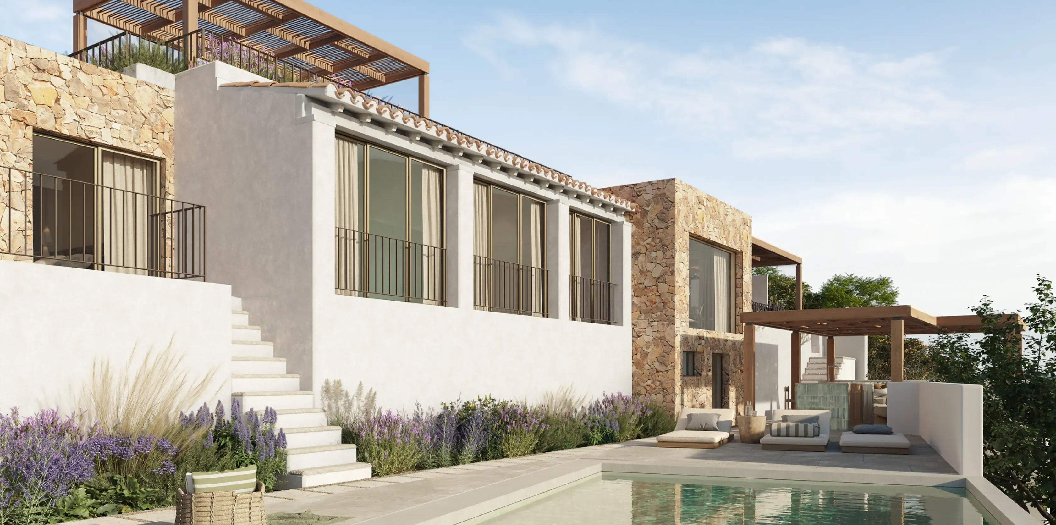 Elegant Mediterranean villa with stone walls and a private pool reflecting the luxury coastal design.