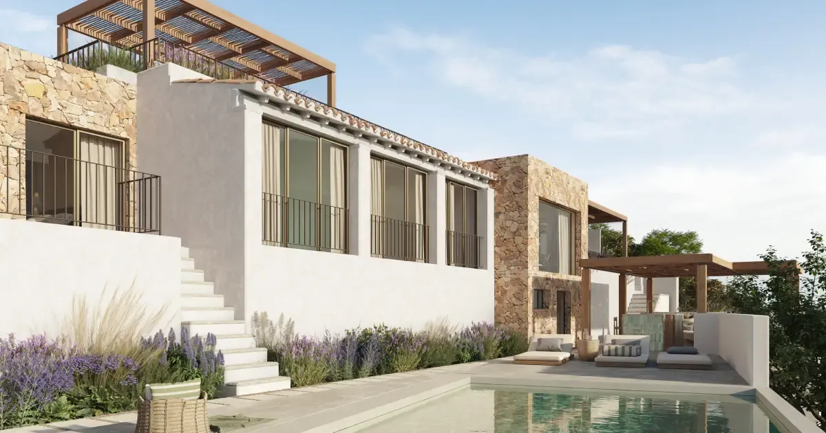 Elegant Mediterranean villa with stone walls and a private pool reflecting the luxury coastal design.