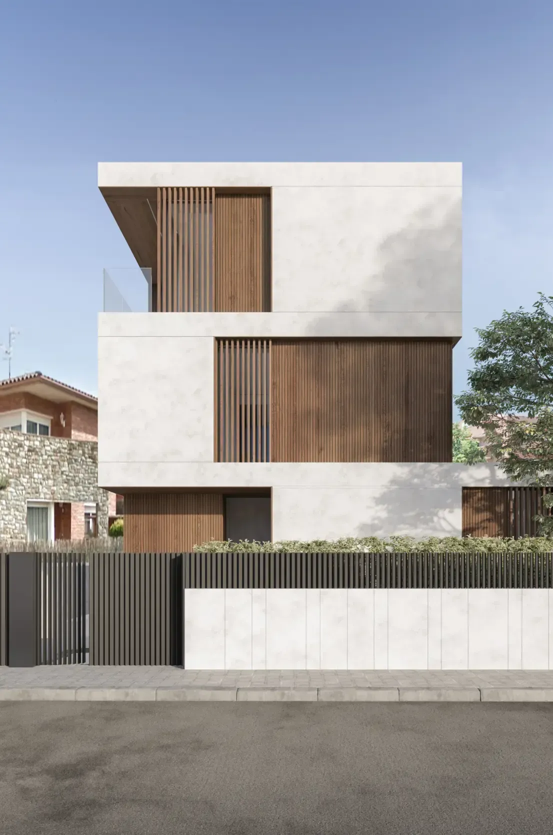 Minimalist facade of a luxury Luv studio residence combining white concrete and vertical wooden slats.
