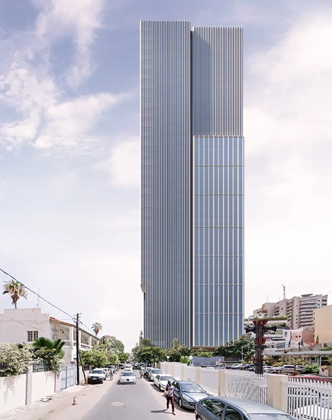 Daytime view of the Energy Tower rising above the city, with vertical lines and glazed façades dominating the skyline.