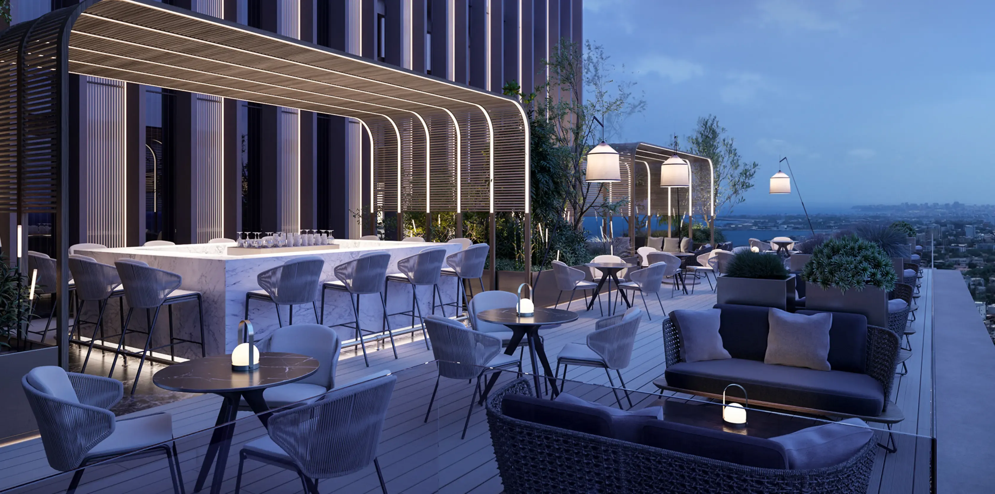 Panoramic rooftop bar with ambient lighting, marble counter, modern seating, and stunning views of the city skyline.