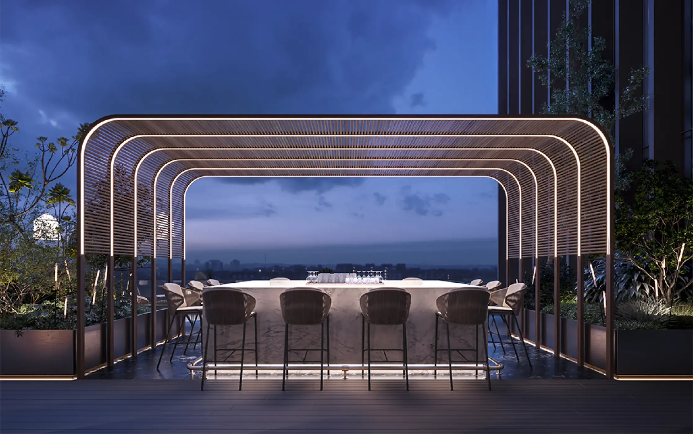Skybar interior with cozy seating, reflective ceiling, and a sculptural round bar illuminated by dramatic vertical lighting.