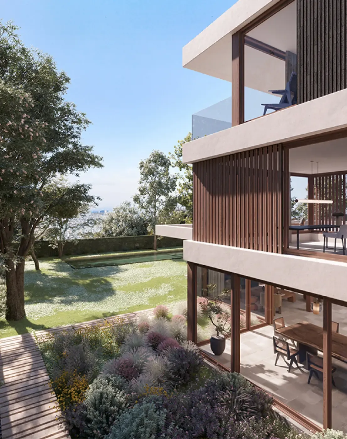 View from garden with large glass windows and integrated outdoor terrace