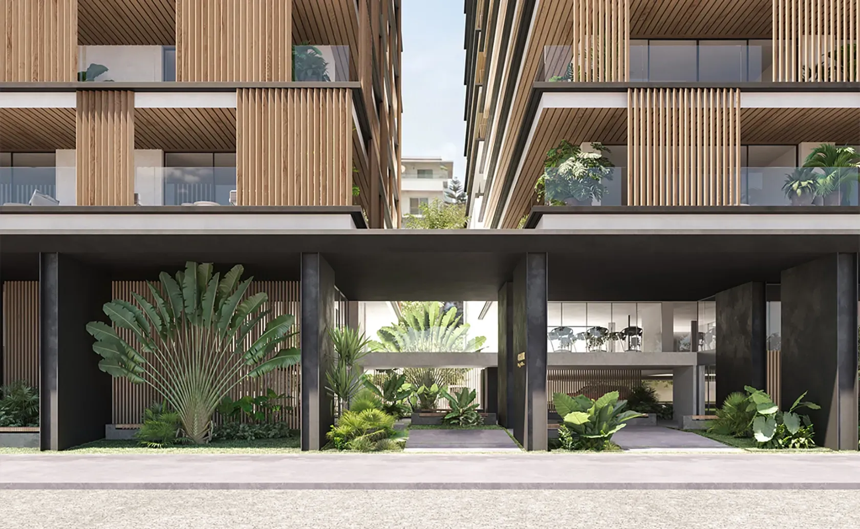 Entrance view of Carlyle Luxury Residences framed by lush greenery and vertical wooden slats