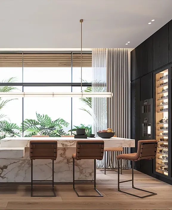 Designer kitchen at Carlyle Luxury Residences with marble surfaces, integrated wine storage and garden views