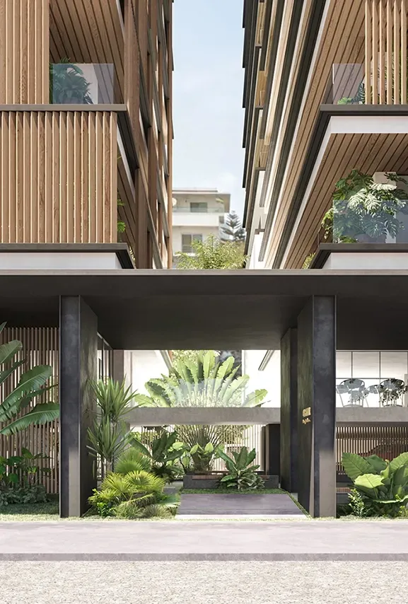 Entrance view of Carlyle Luxury Residences framed by lush greenery and vertical wooden slats
