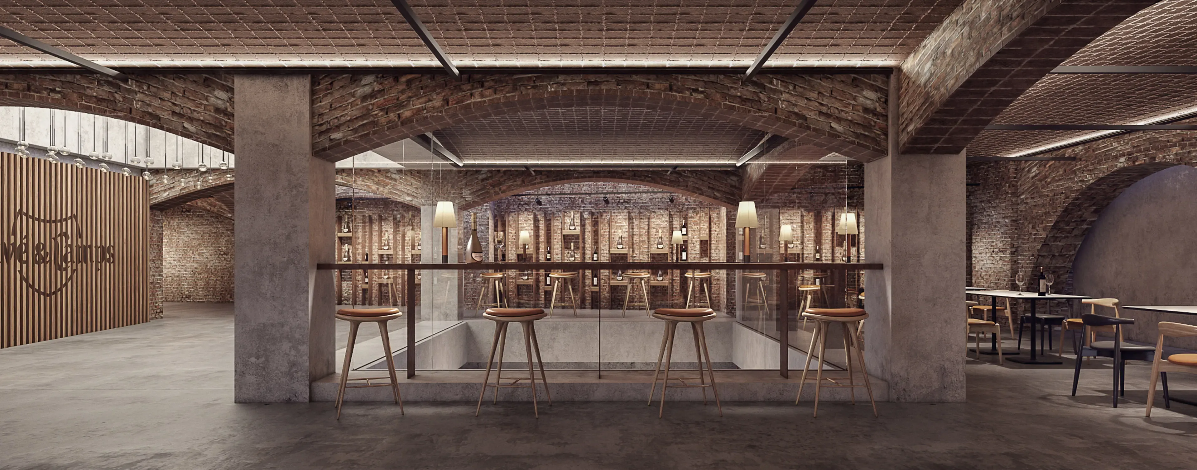 View through glass railing to the wine lounge with seating under brick barrel-vaulted ceilings at Juvé & Camps.