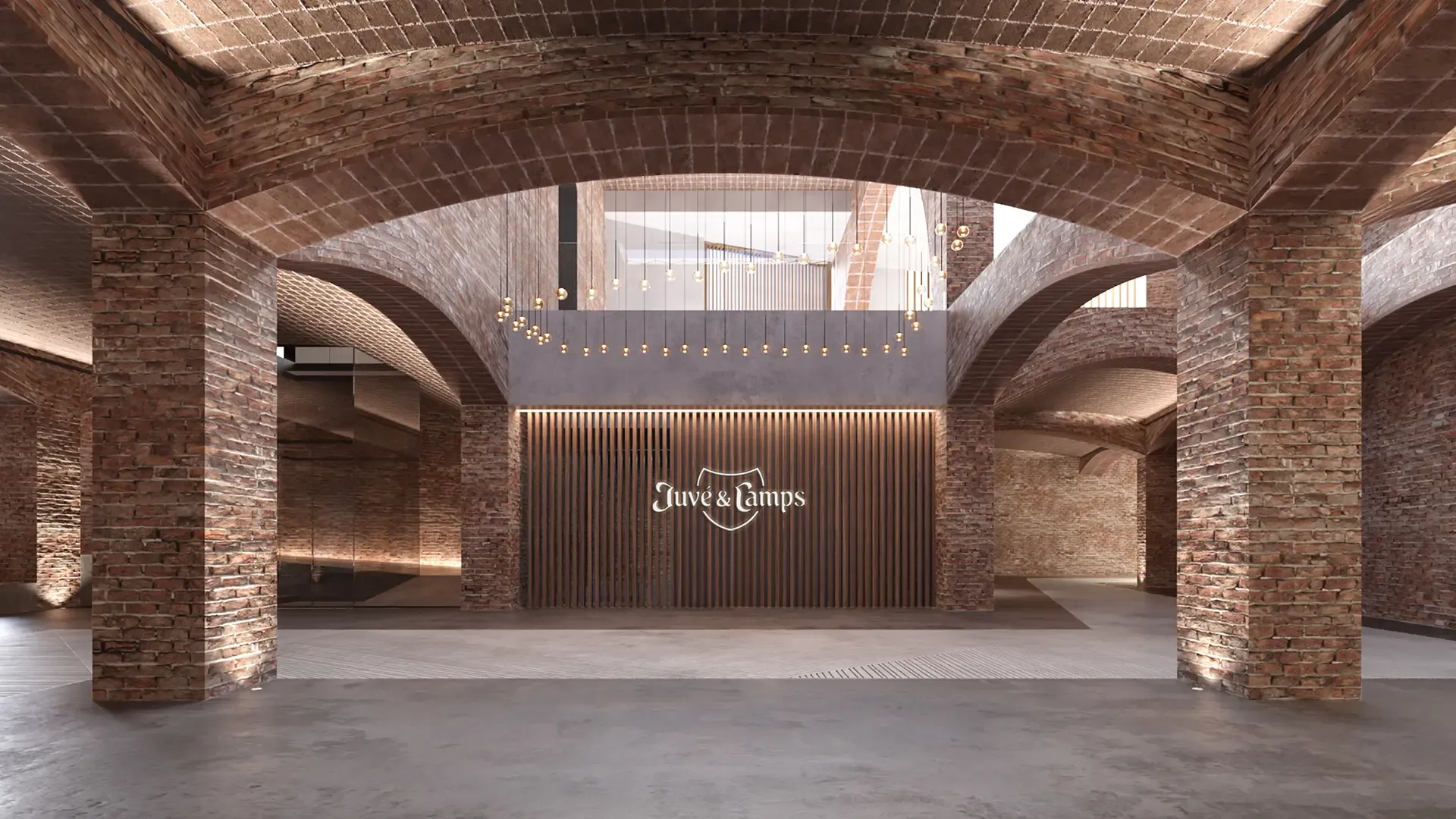 Entrance lobby of Juvé & Camps Winery showcasing vaulted brick architecture and warm ambient lighting.