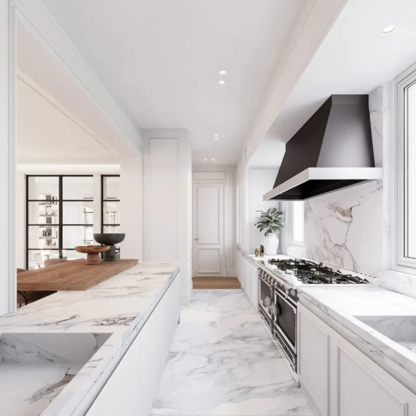 Elegant marble kitchen with white cabinetry, a black range hood, and open layout connected to a dining area.