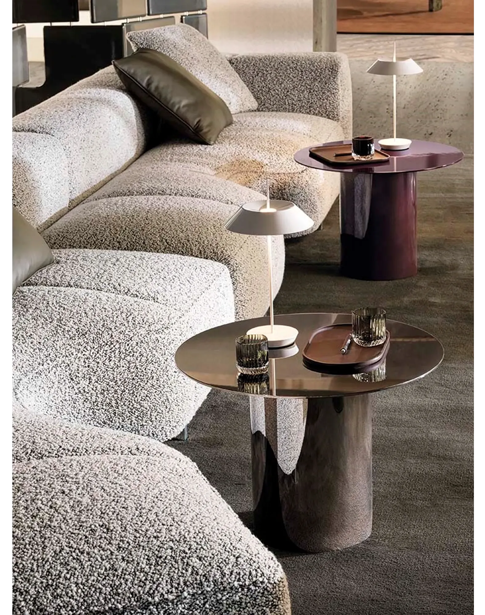 Modern living room with low-profile sofa and sculptural lighting elements