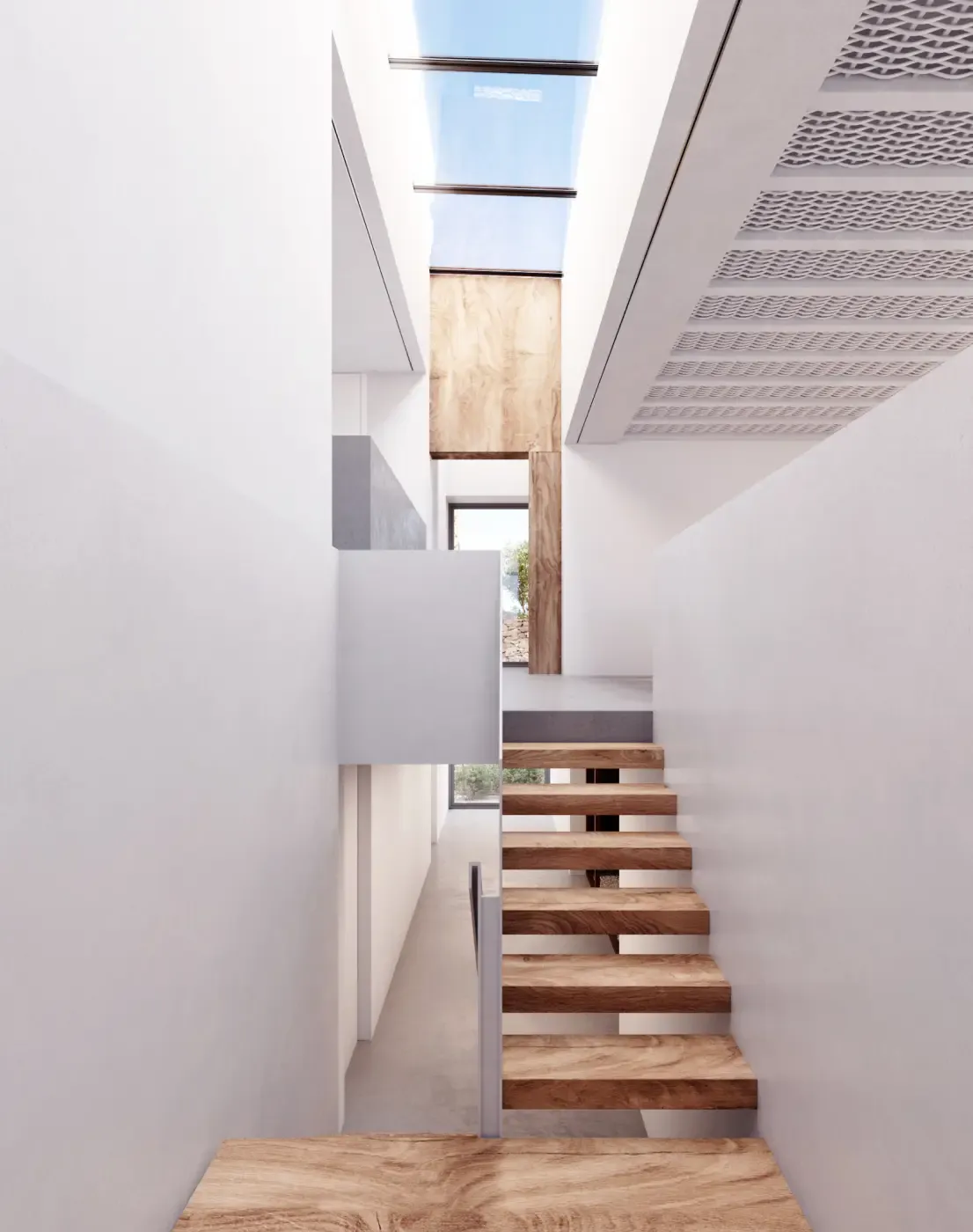 Contemporary floating wooden staircase under a skylight in a minimalist Menorcan villa.