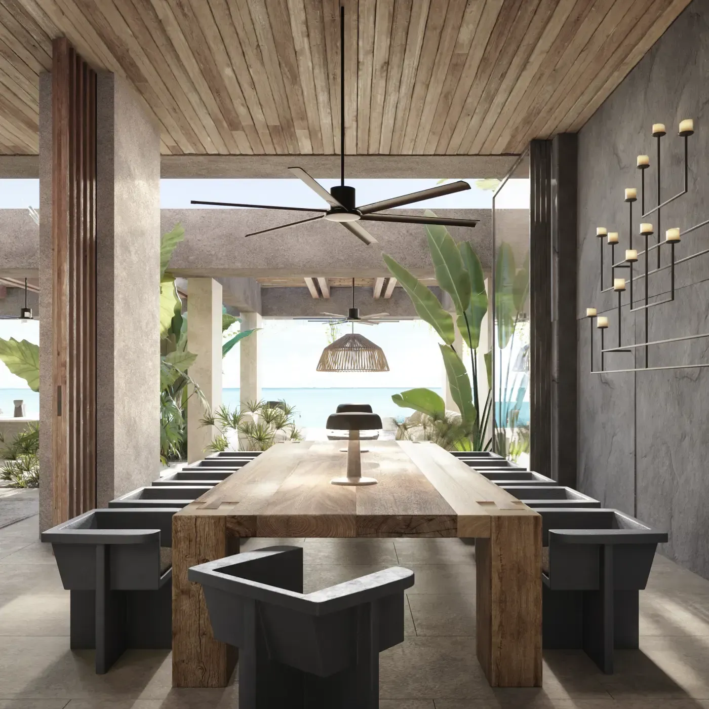 Contemporary dining room with a long wooden table, sculptural chairs, and view toward the sea.