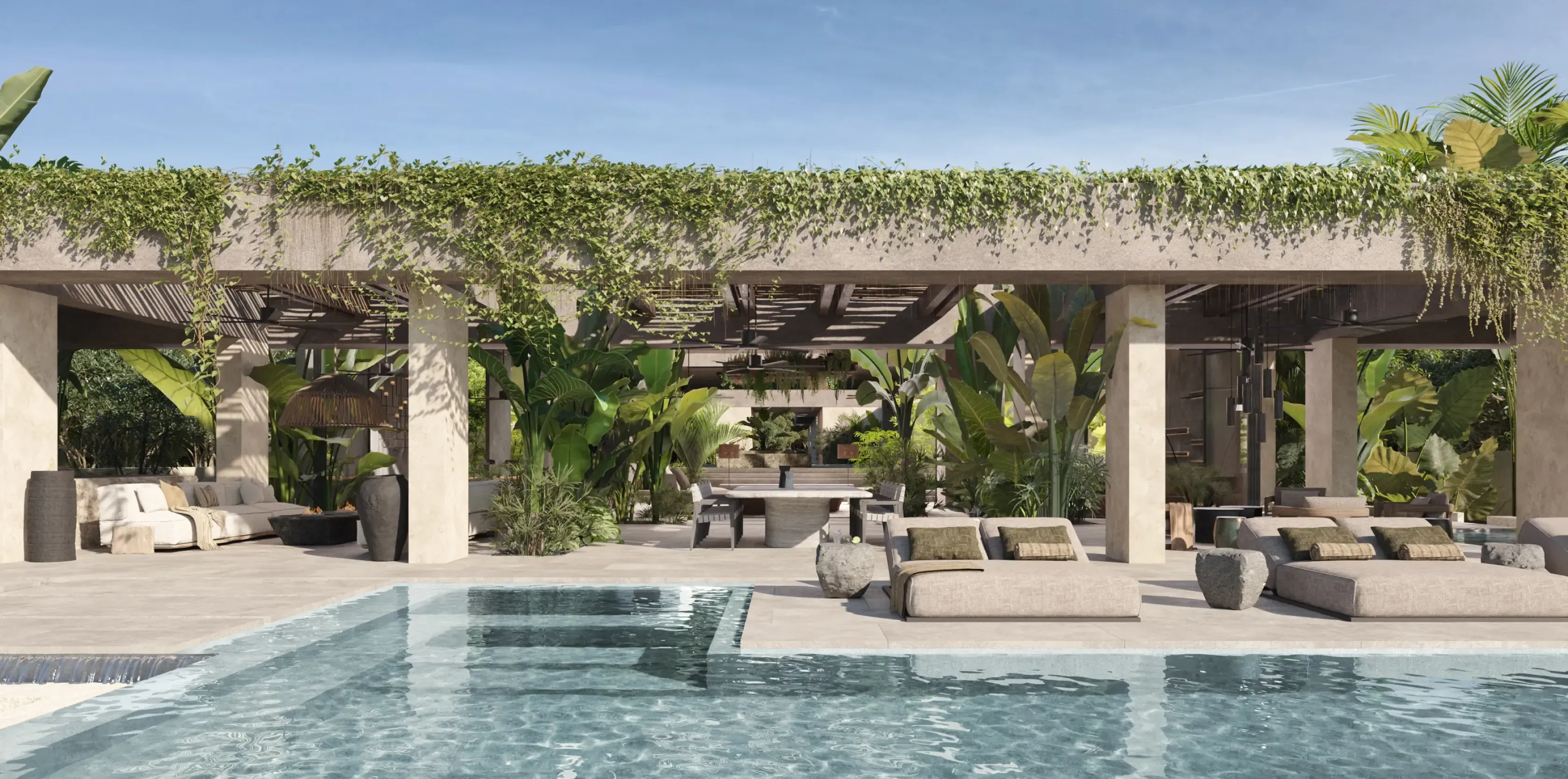 Luxury tropical villa with a shaded lounge area and pool surrounded by lush greenery.