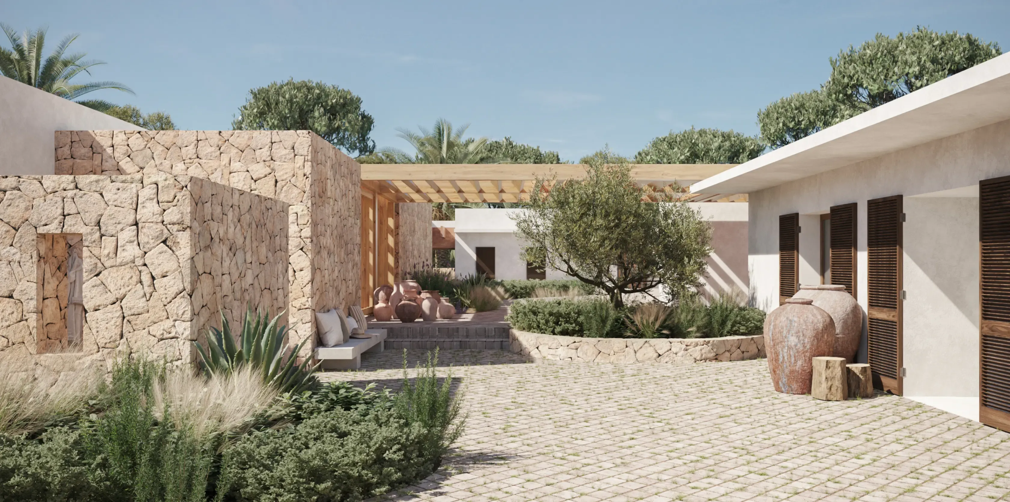 Stone-paved courtyard with Mediterranean vegetation and natural stone walls.