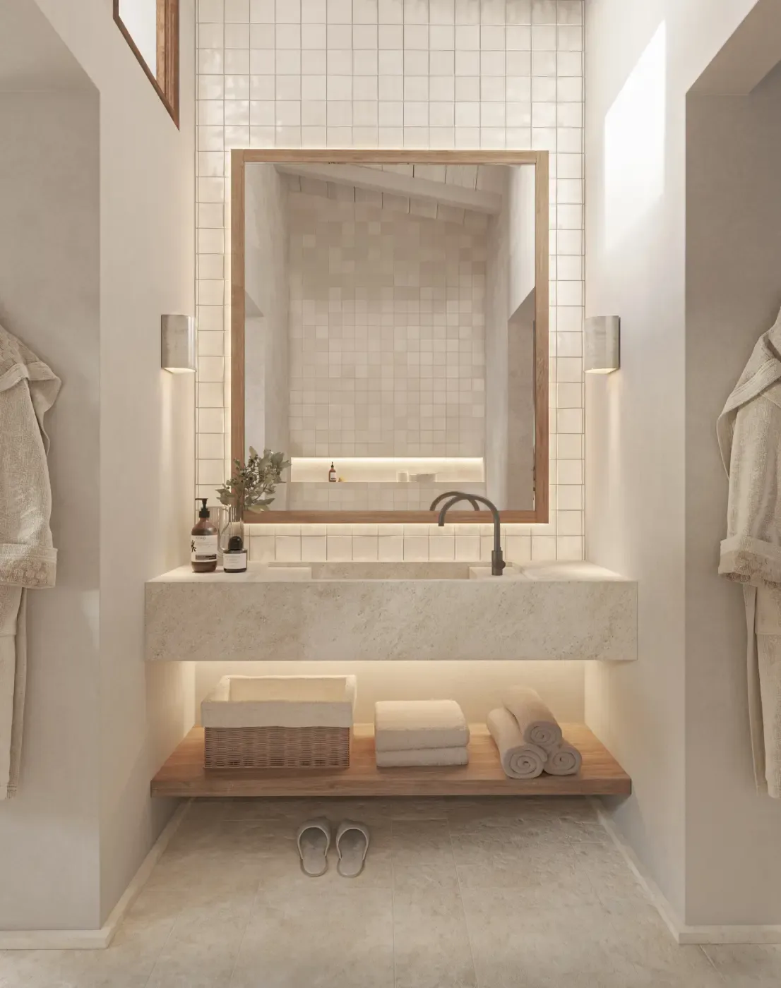 Minimalist bathroom with stone sink, large mirror, and natural light.